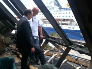 In this photo released by Royal Caribbean, Adam Goldstein, pres & CEO, & Anders Aasen, AVP Technical Services inspect the damage on deck six of the Grandeur of the Seas following a fire.  