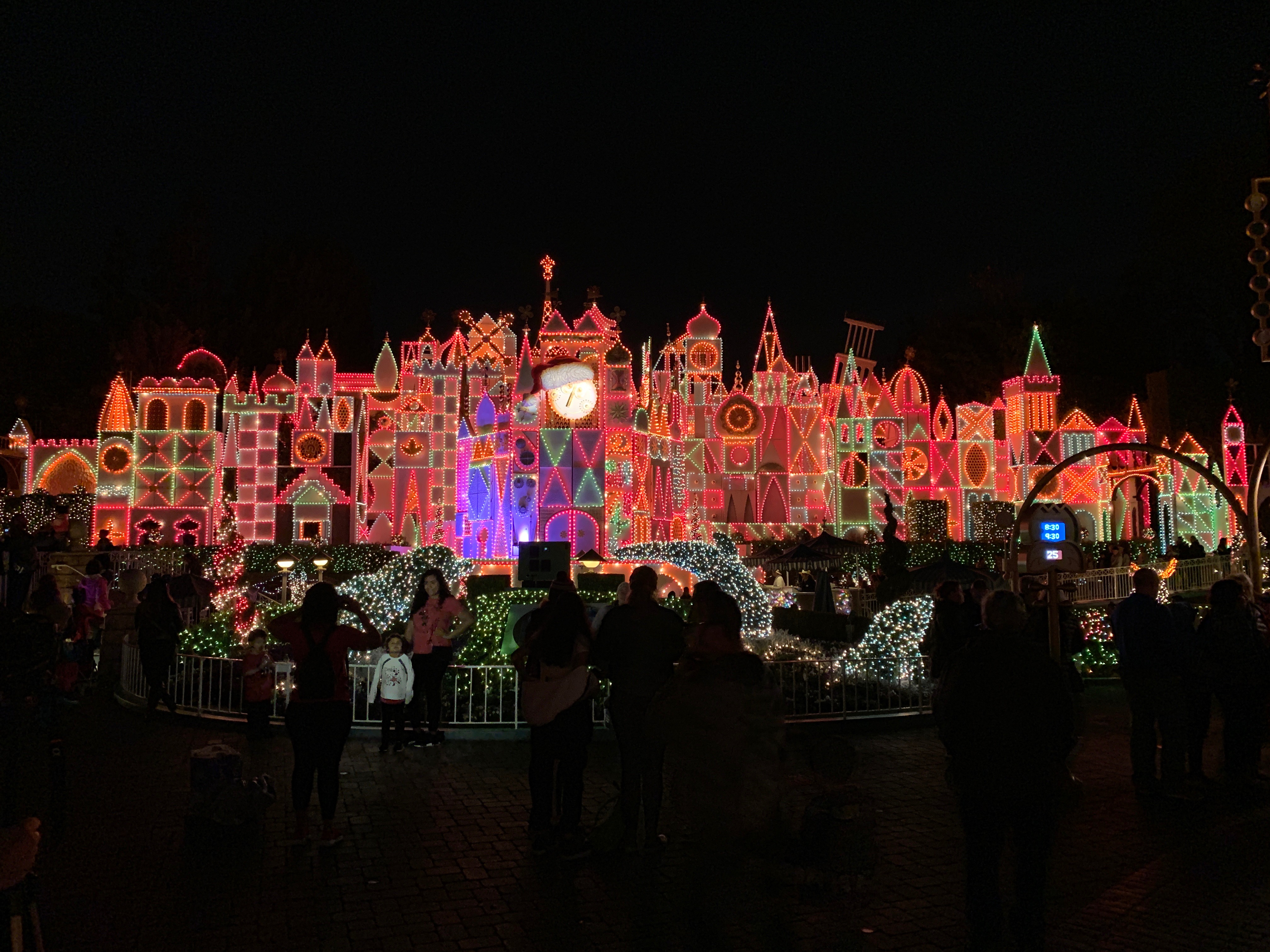 it's a small world at Disneyland Park in Anaheim, CA during the holiday overlay