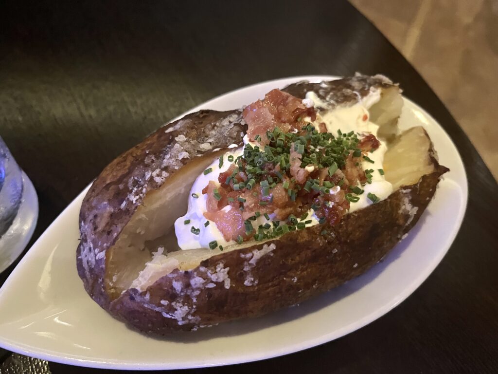 Loaded Baked Potato from Council Oak Steakhouse at the Hard Rock Casino in Ft. Lauderdale